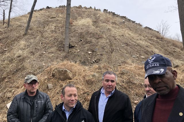 U.S. Rep. Josh Gottheimer (second from left) visits an eight story dirt pile in Vernon last month with local elected officials. Gottheimer says he’s trying to find federal funding to help clean up the illegal dump.